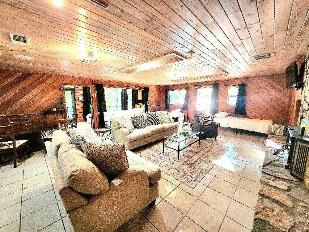 A living room filled with furniture and a fireplace.