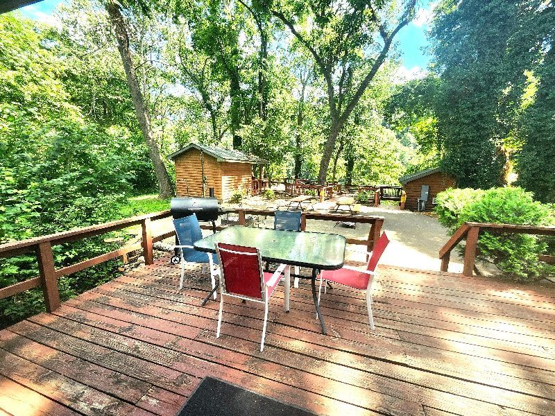 table and chairs on a shaded deck