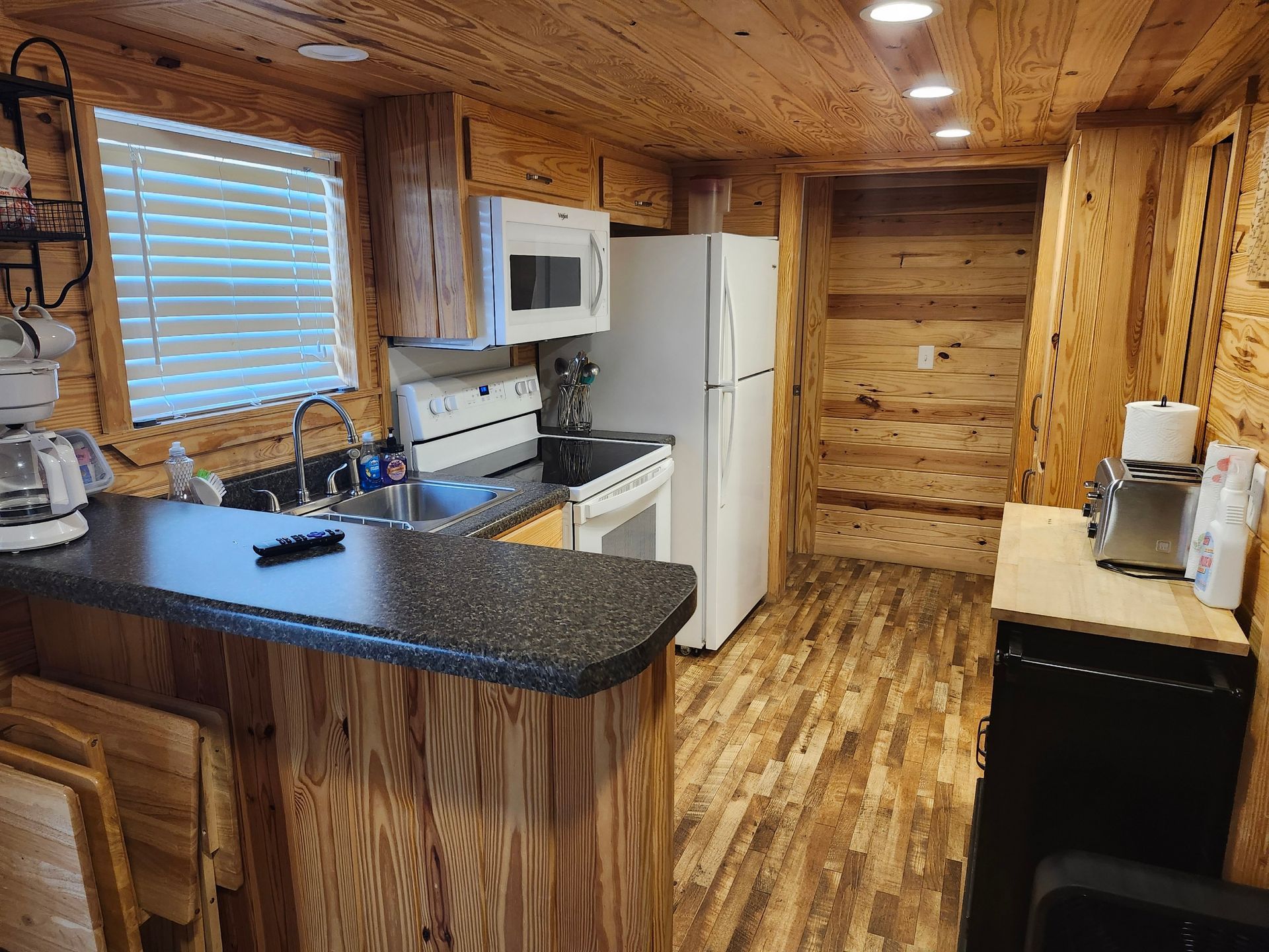 full kitchen with coffee pot and microwave copper johns zoo cougar cabin