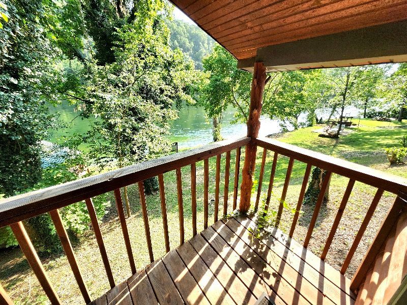 covered deck cabin 1 overlooking white river at copper johns resort