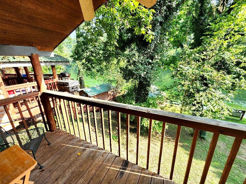 covered deck with view of forest and white river copper johns cabin 1