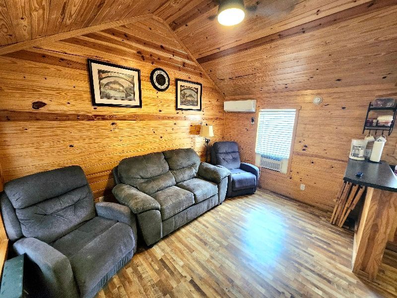 cozy recliners and sofa in a cabin at copper johns resort