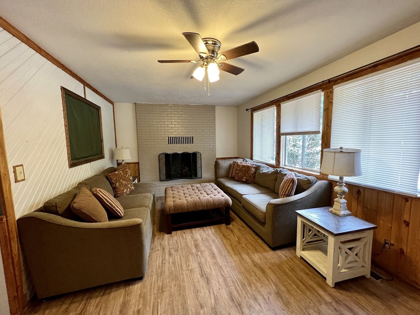 family room with couches, ottoman, and a fireplace in a cabin at copper johns resort