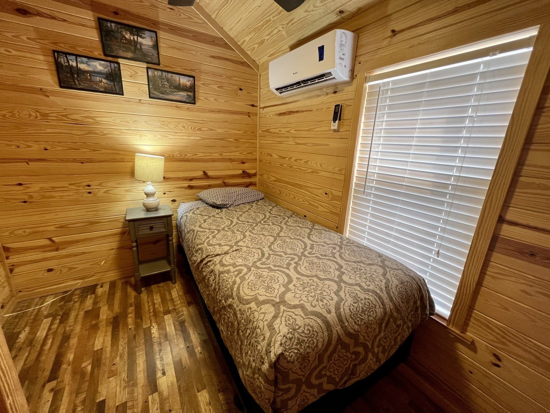 twin bed with nightstand in zoo cougar cabin at copper johns