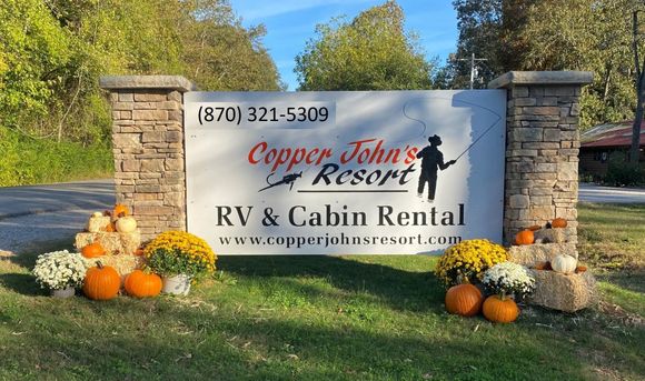 Copper john 's resort rv and cabin rental sign