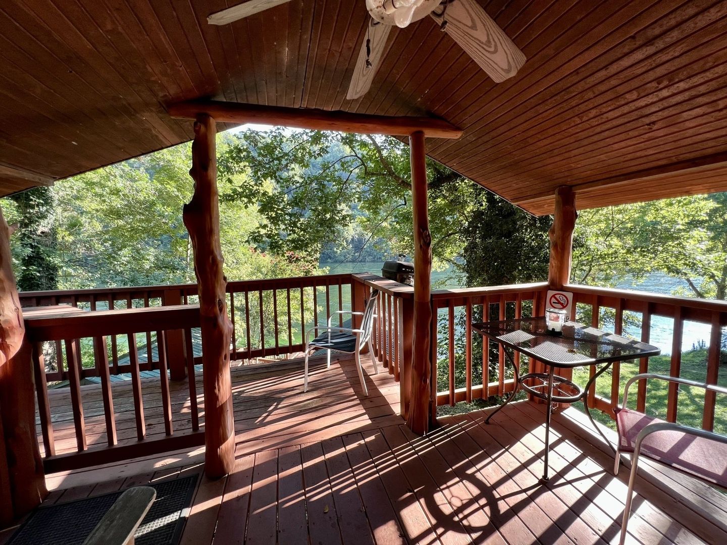 large wooden deck with ceiling fan at copper johns resort