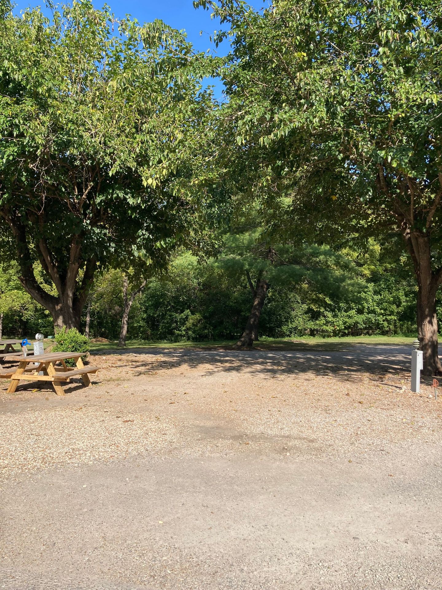 oversized pull through RV site with full hookups, picnic table, and firepit copper johns