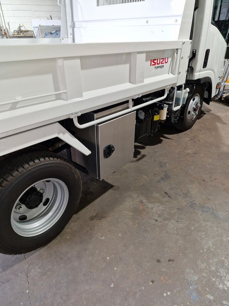 White Isuzu Dump Truck, Side View — Cairns Metal Works in Portsmith, QLD