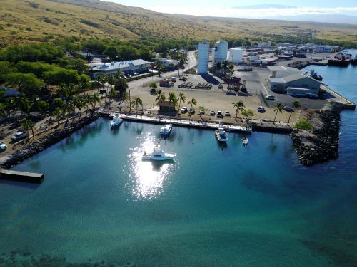 An aerial view of a harbor with boats docked in it