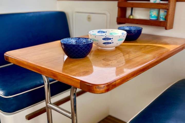 A wooden table with two bowls on it