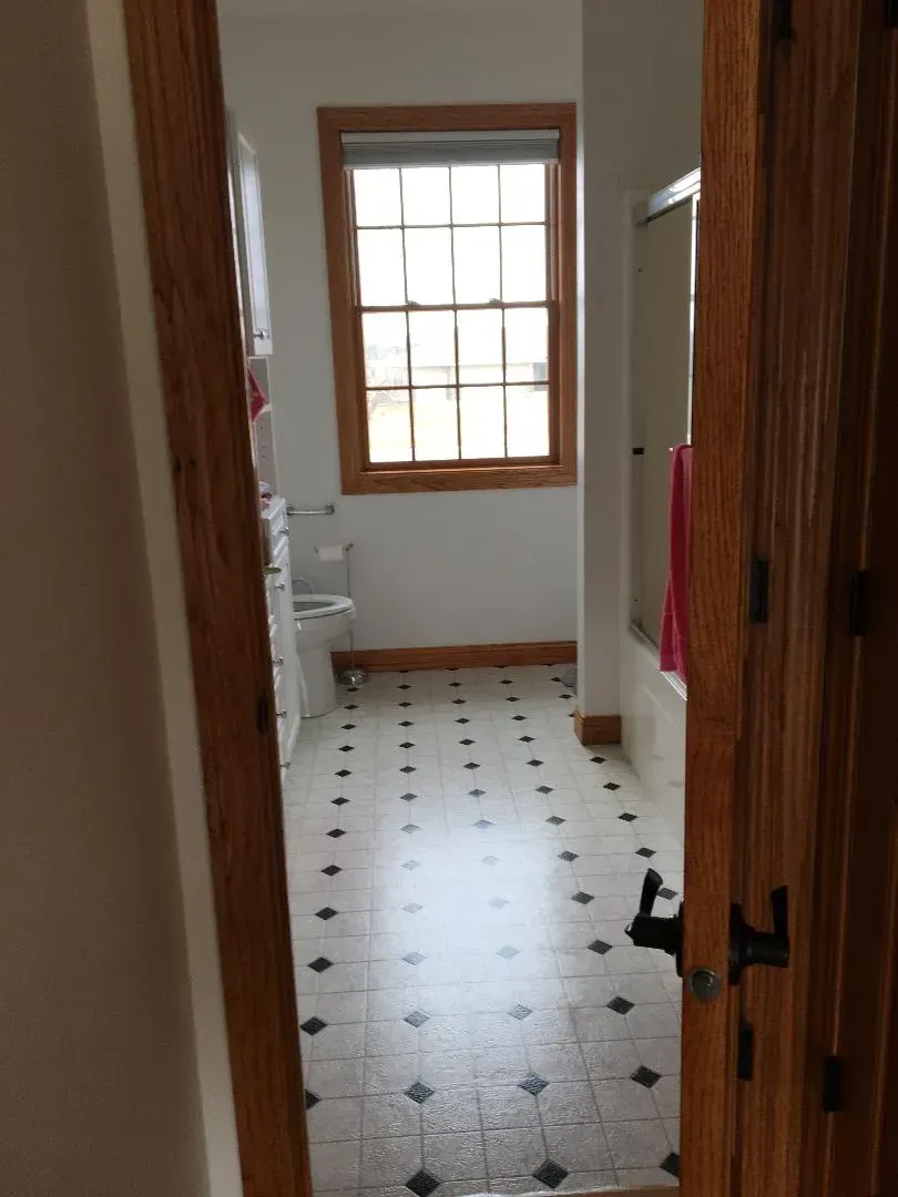 Bathroom with a Tiled Floor — Iowa City, IA — Olson Remodeling & Construction
