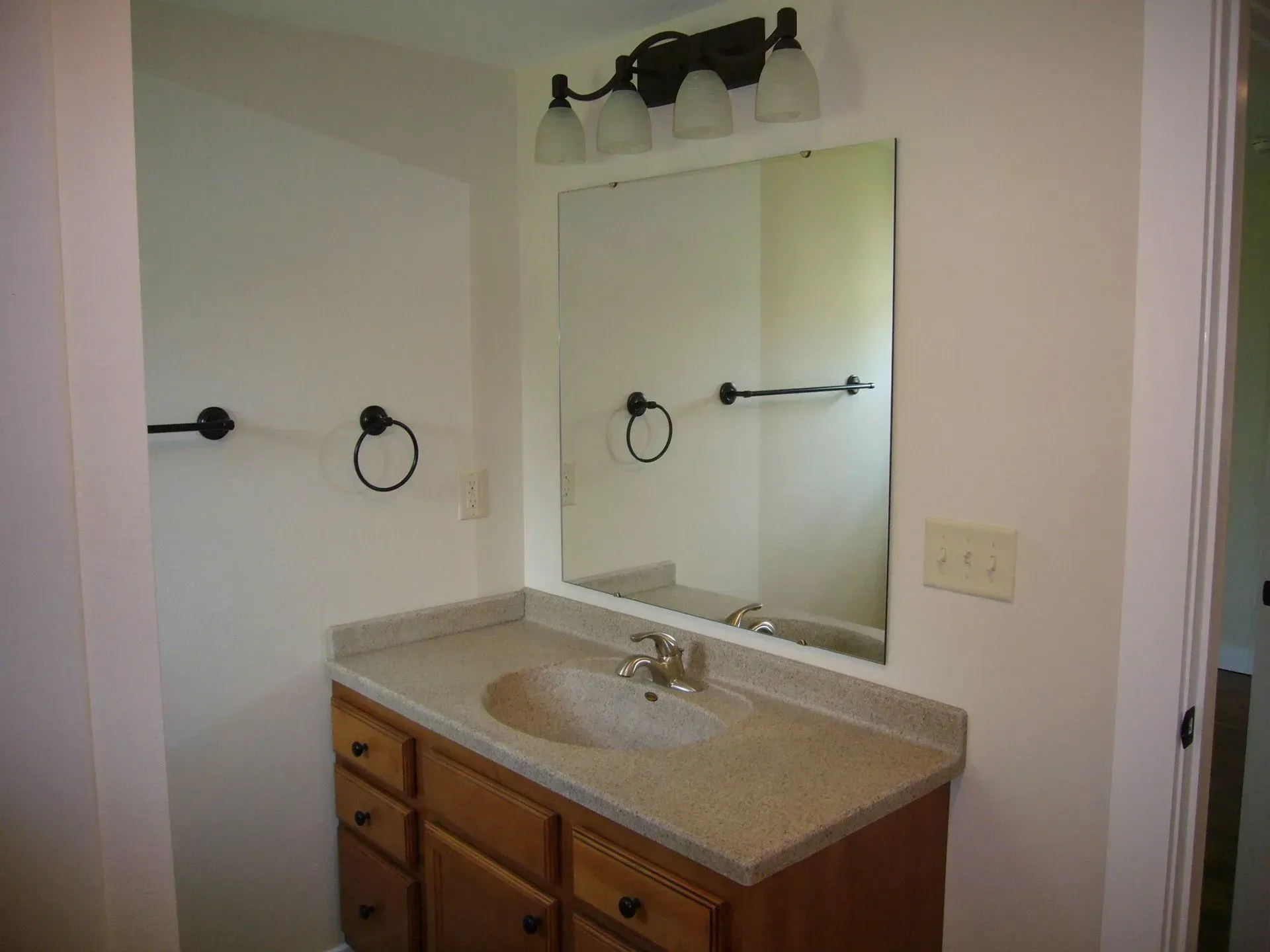 Bathroom with Sink and Large Mirror — Iowa City, IA — Olson Remodeling & Construction