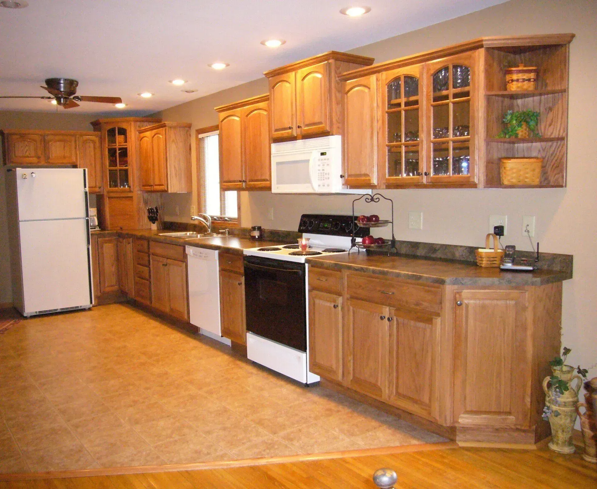 Kitchen with Wooden Cabinets — Iowa City, IA — Olson Remodeling & Construction