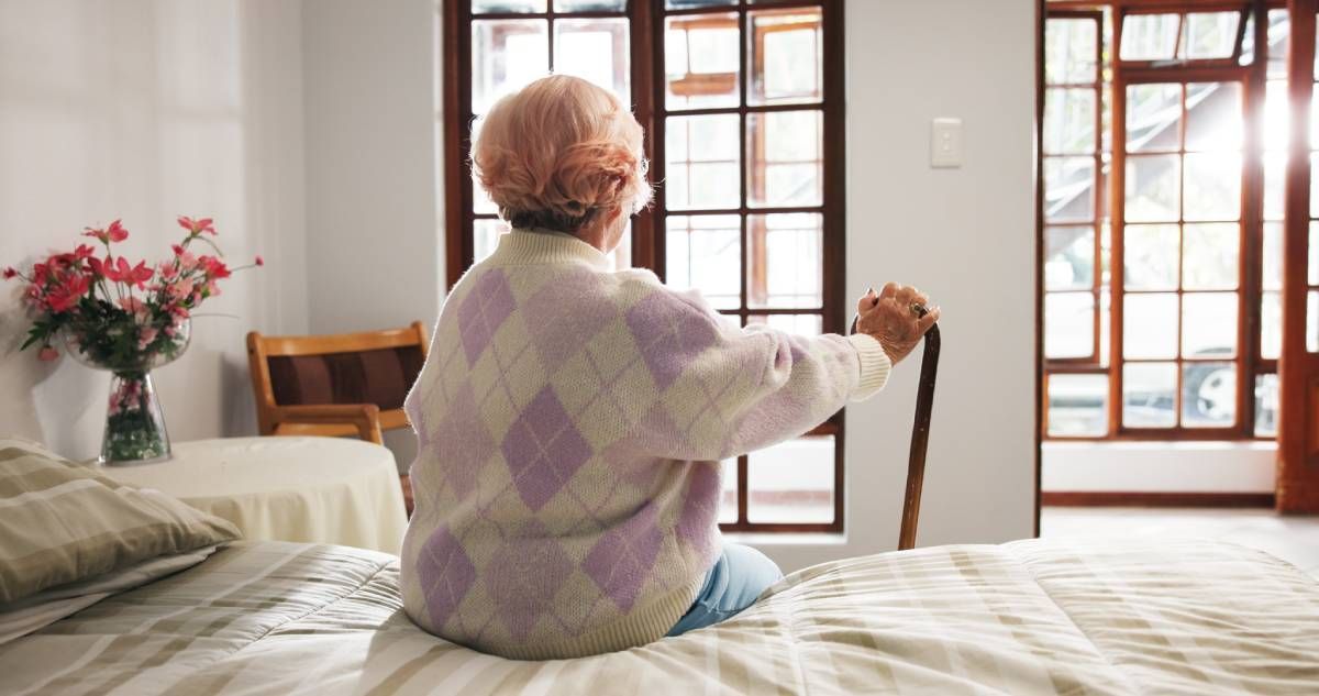 A community member sitting in their home and looking outside near Cincinnati, Ohio (OH)