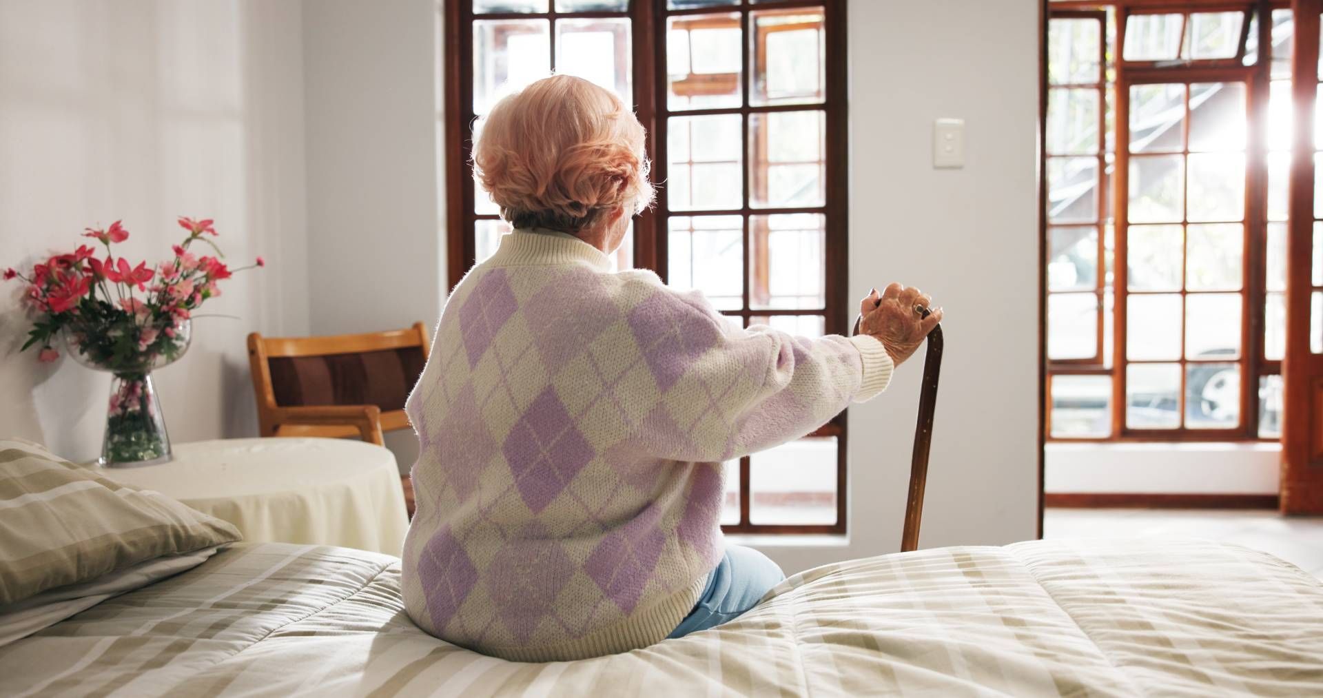 A community member sitting in their home and looking outside near Cincinnati, Ohio