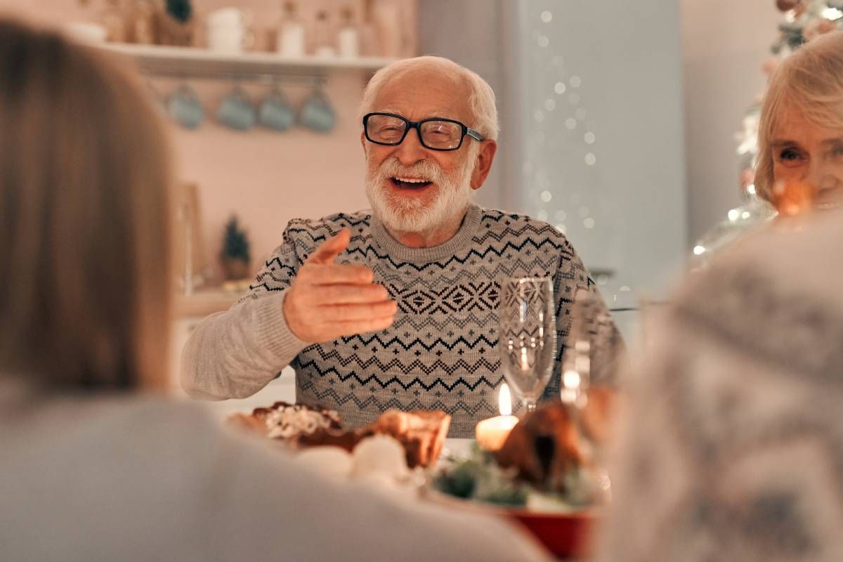 A family enjoying a meal together during the Christmas holiday season at Siverfern Cincinnati North near Cincinnati, Ohio (OH)