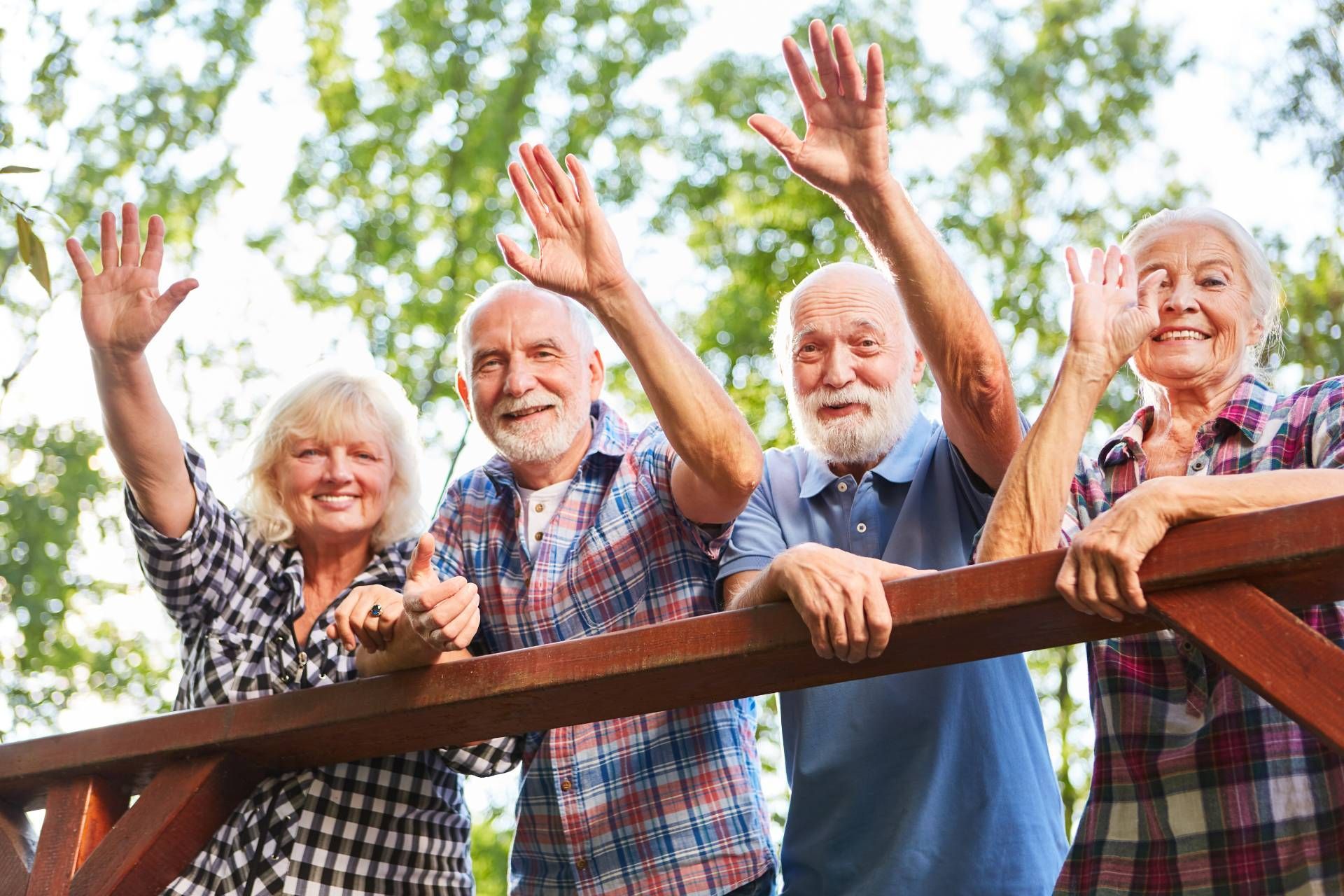 Four active seniors wave from a bridge near Cincinnati, Ohio (OH)