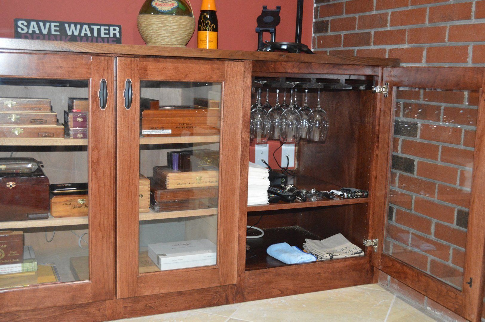 View of white wine refrigerator, humidor and glass cabinet 