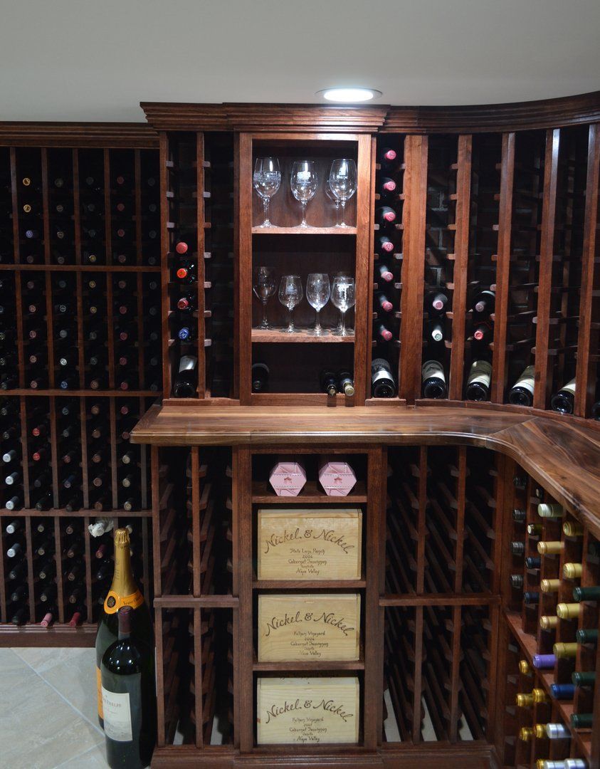 View of stemware cabinet with double deep wood case below
