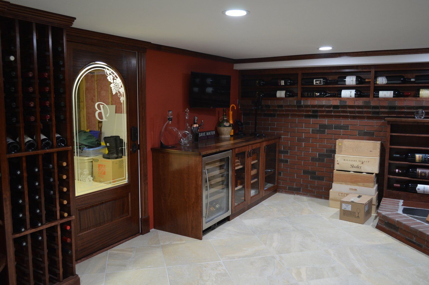 View of white wine refrigerator, humidor, glass cabinet and 