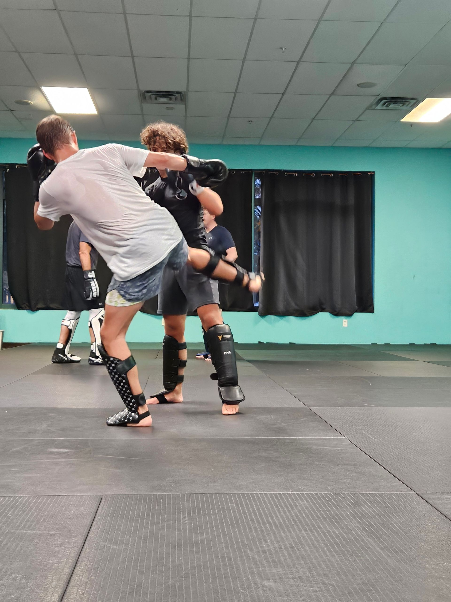 Adults drilling Brazilian Jiu-Jitsu at Rip Tide Brazilian Jiu Jitsu in Lewes, DE to build confidence and safety skills