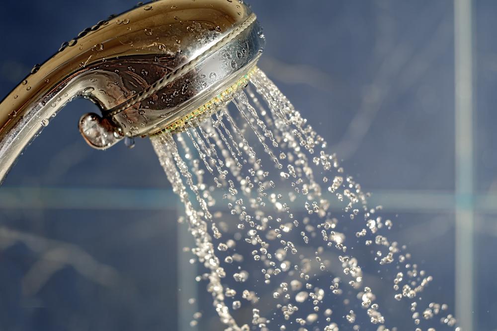 Household Water — A Metal Shower Water Flows in Antonio, TX