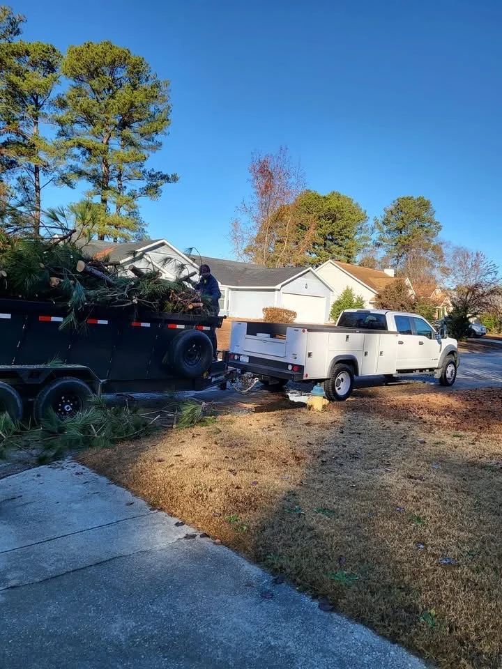 A white truck is parked in front of a house.