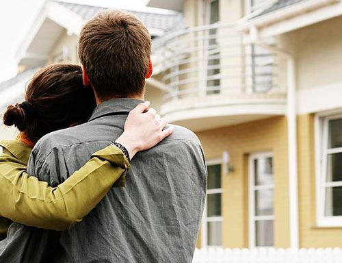 Couple looking at house