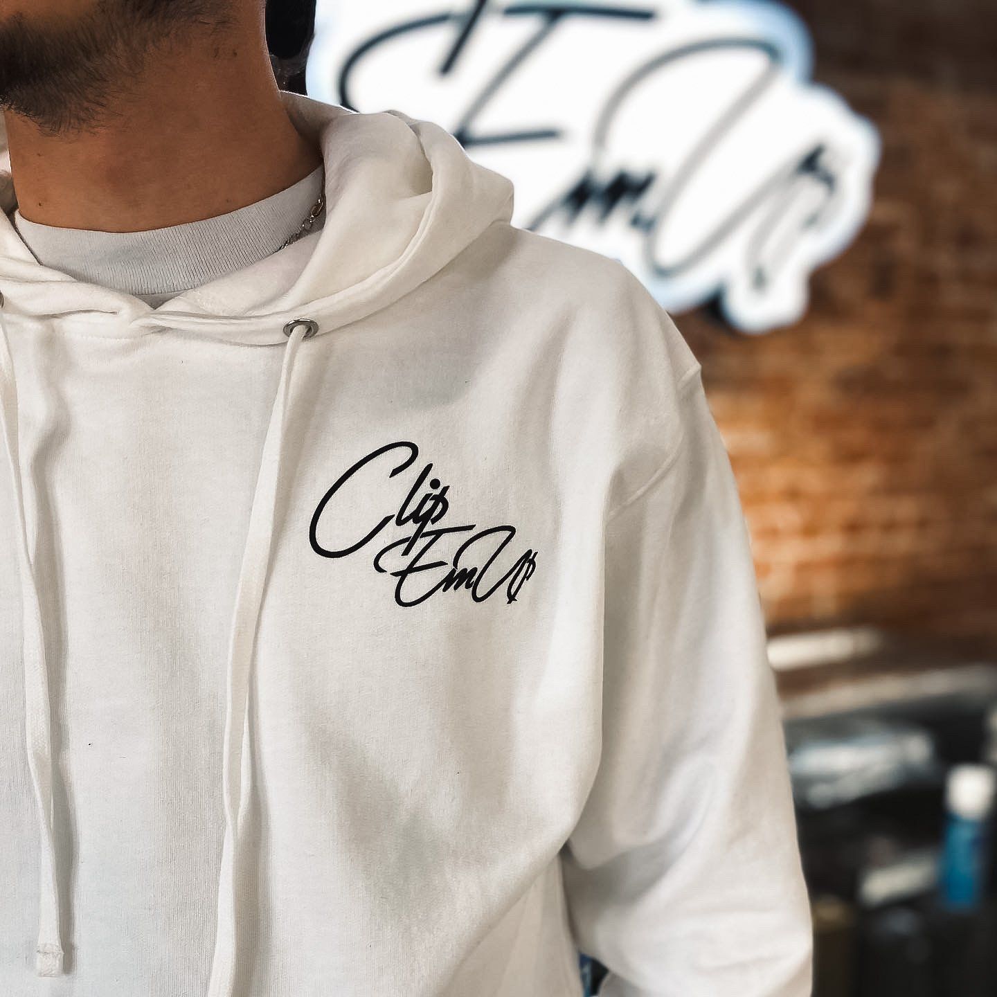 White Hoodie with Clip Em' Up staple logo