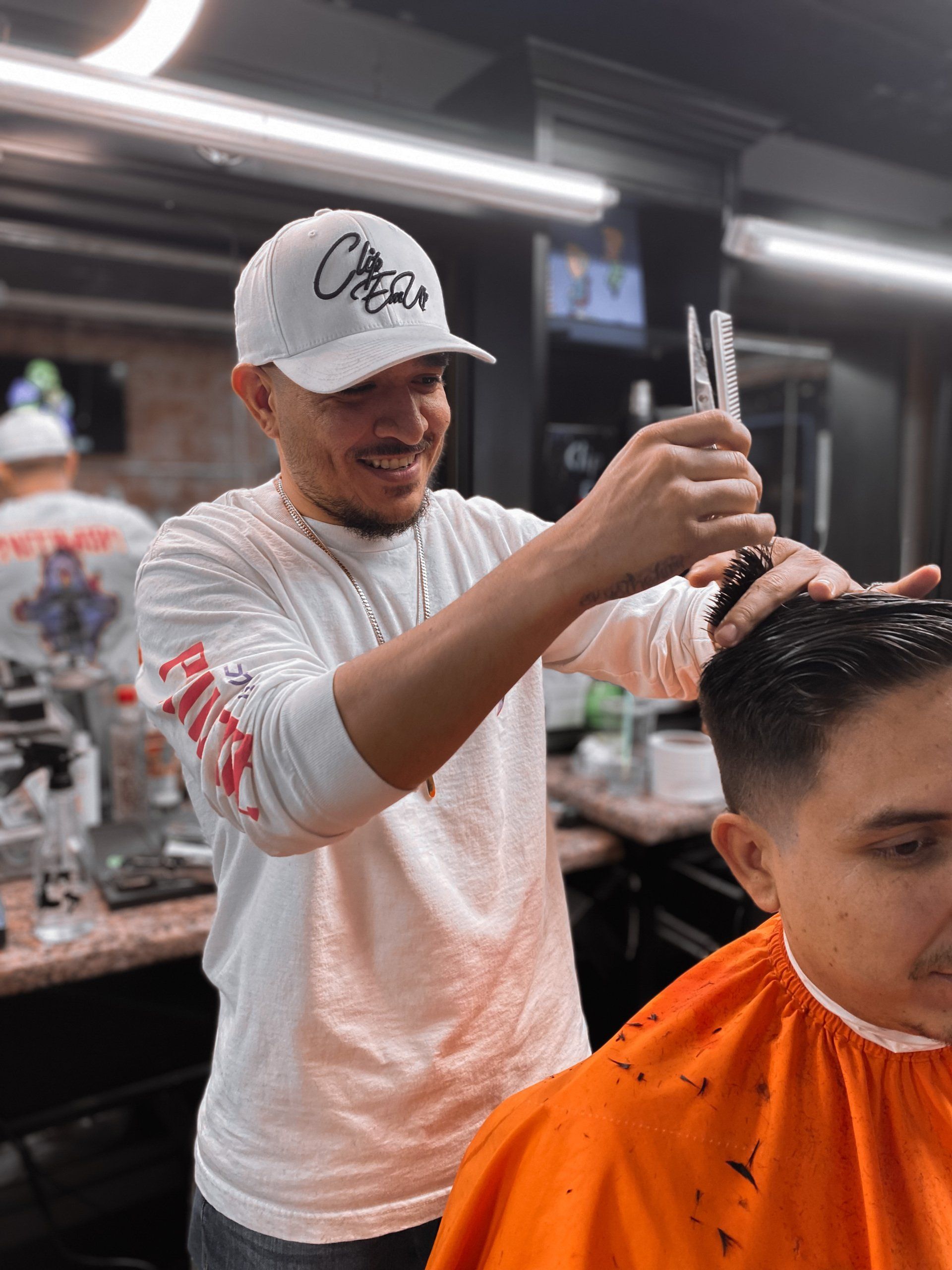 Sergio giving haircut at Clip Em' Up in El Centro, Ca