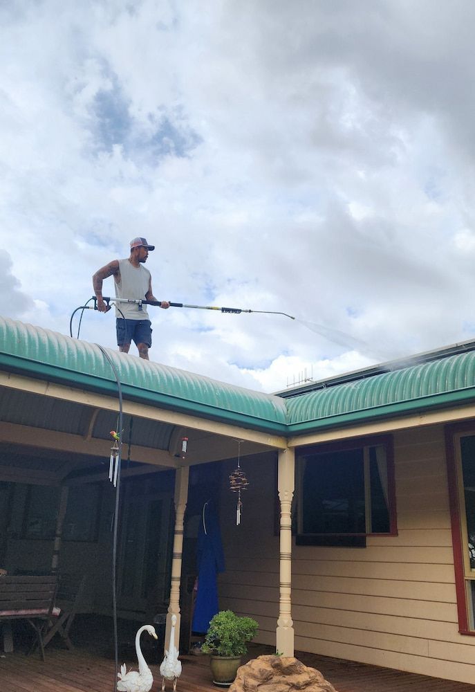 Man on a Roof Pressure Washing — Rapid Rinse Solutions in Katunga, VIC