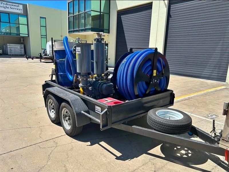 Man Cleaning Gutters With a Vacuum and Long Hose — Rapid Rinse Solutions in Shepparton, VIC