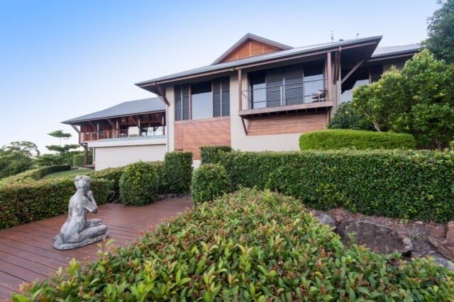 House with a Lot of Plants in the Surroundings — Greg Matthews Building in Woodwark, QLD
