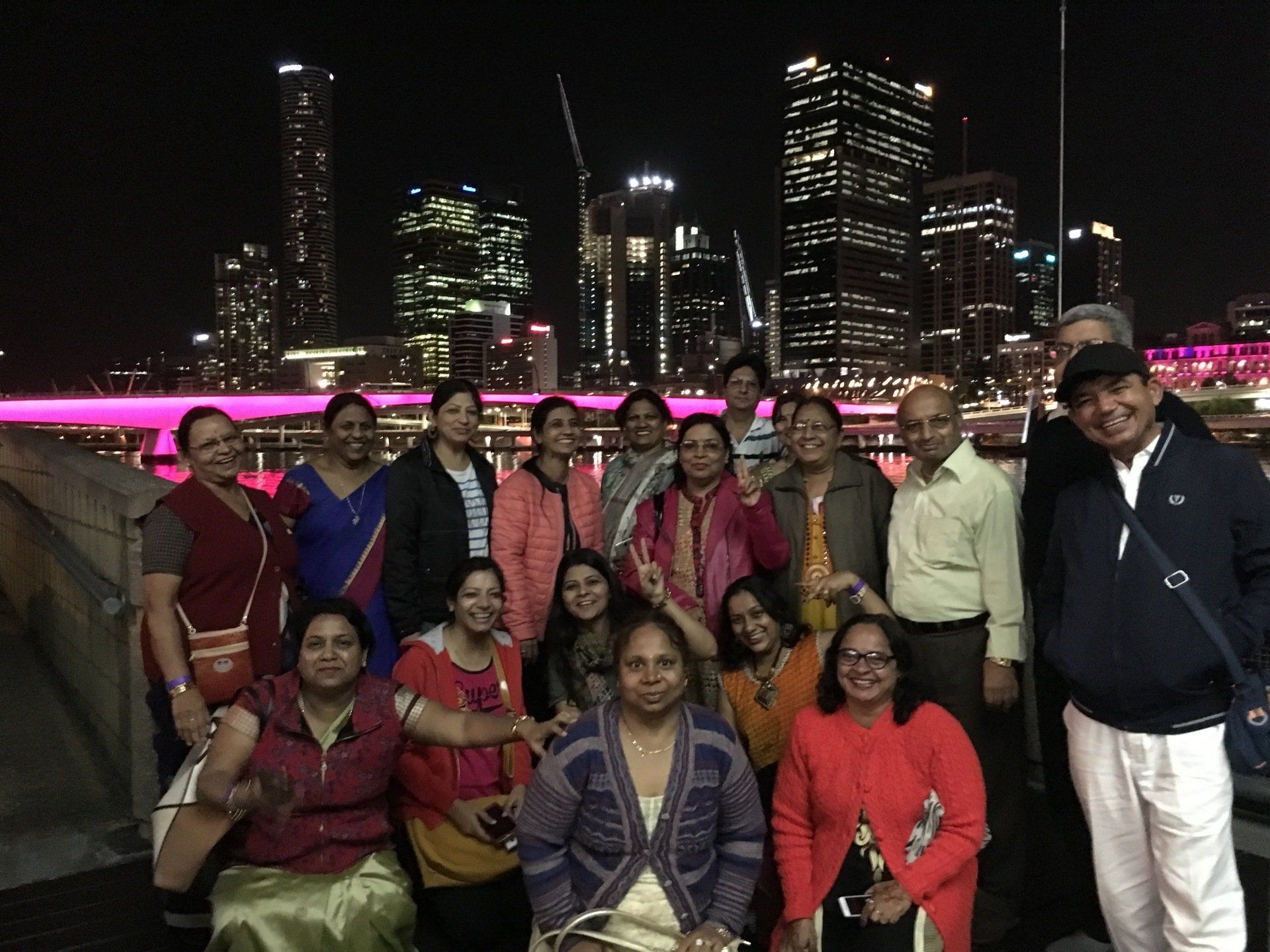 Driver standing in front of a bus