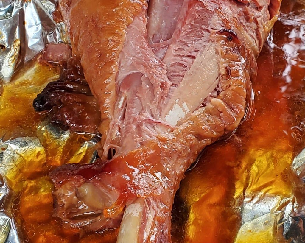 A piece of meat is sitting on top of a piece of tin foil.