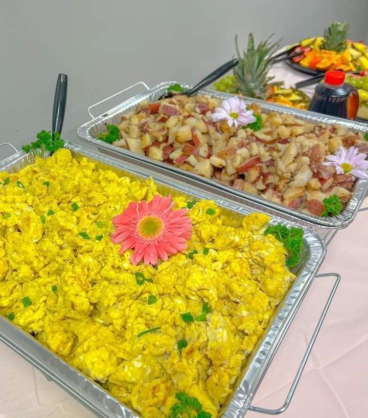 A tray of food with a flower on top of it