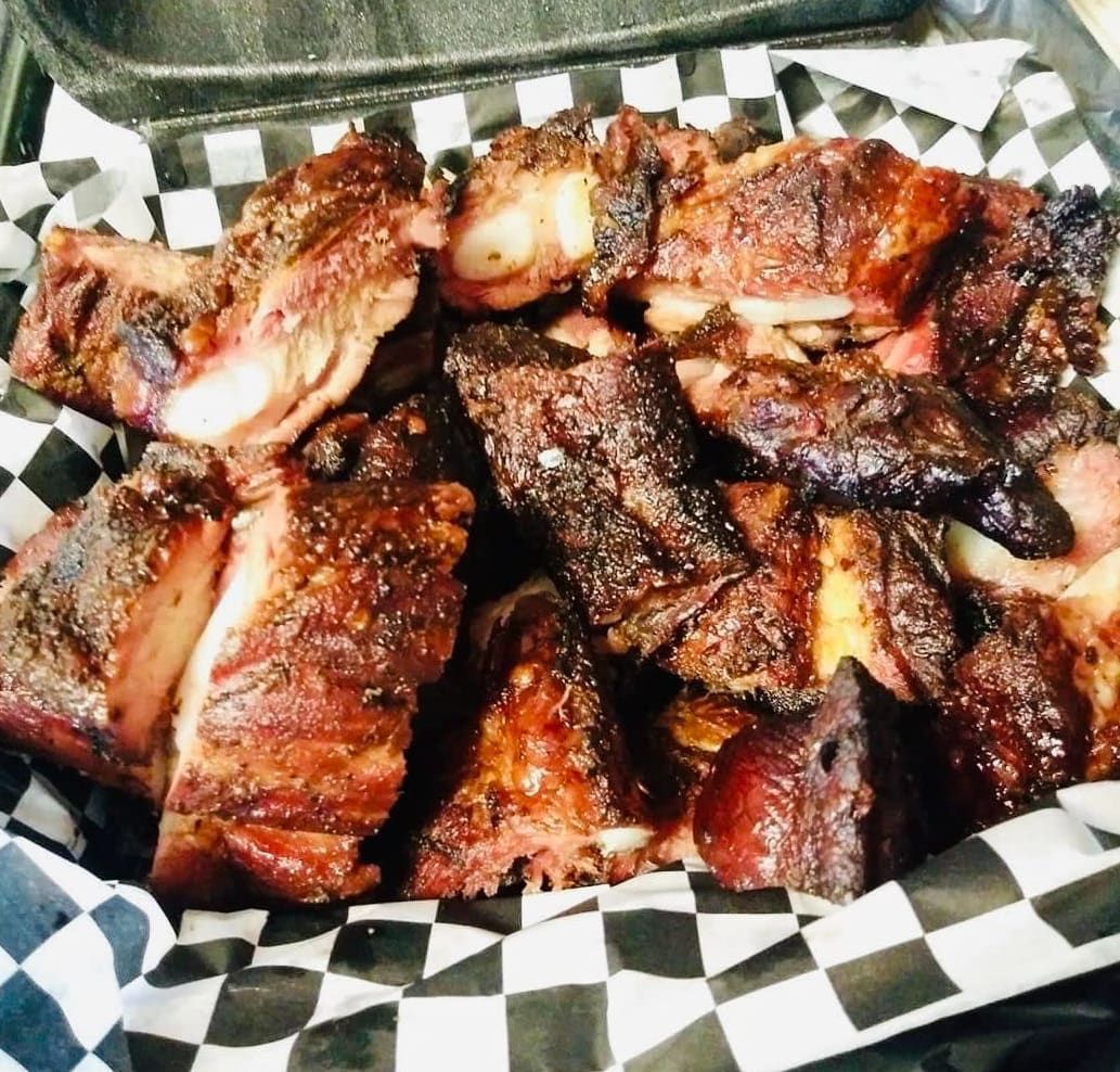 A bunch of meat is sitting on a checkered paper