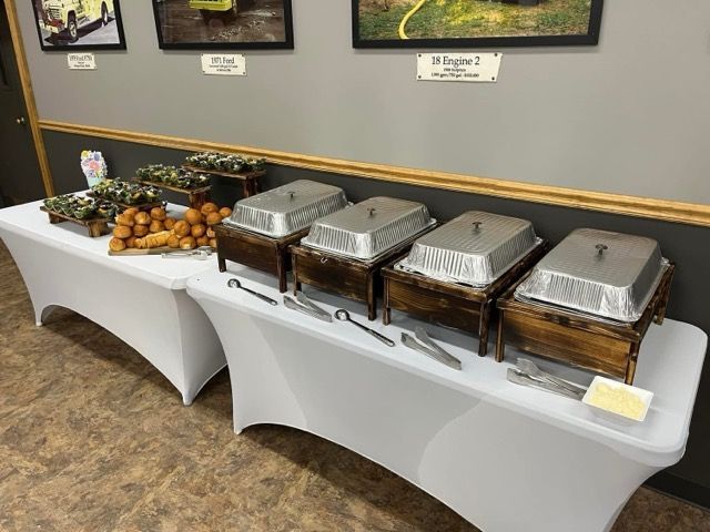A buffet table with a variety of food on it.