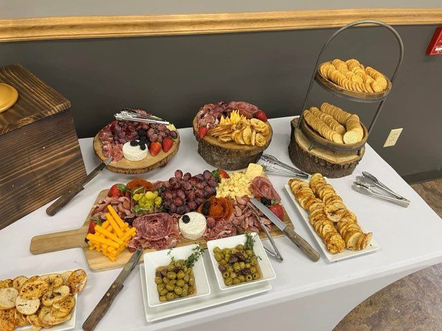 A table topped with plates of food and utensils.