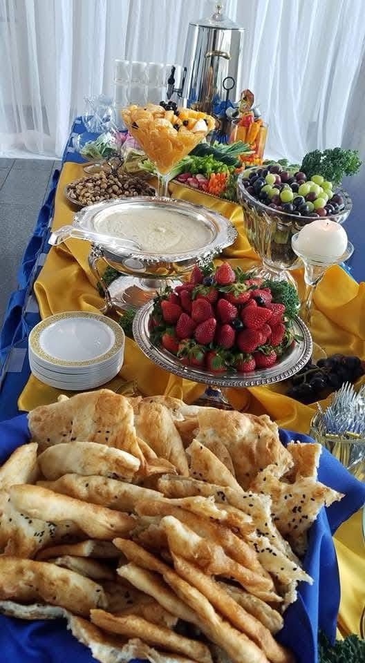 A table topped with a variety of food and drinks.