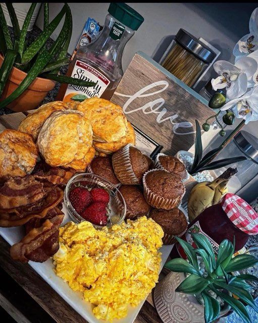 A plate of food with a sign that says love in the background