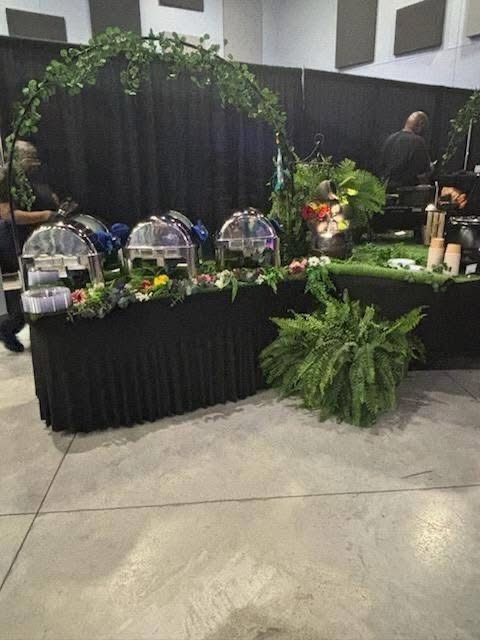 A buffet table with a lot of food on it in a room.