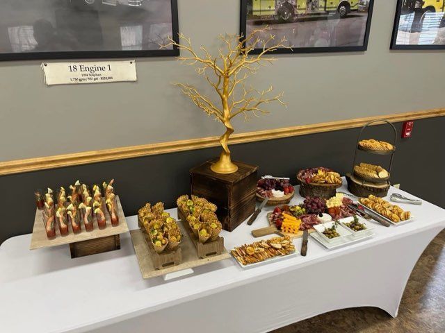 A table with a lot of food on it and a tree on top of it.