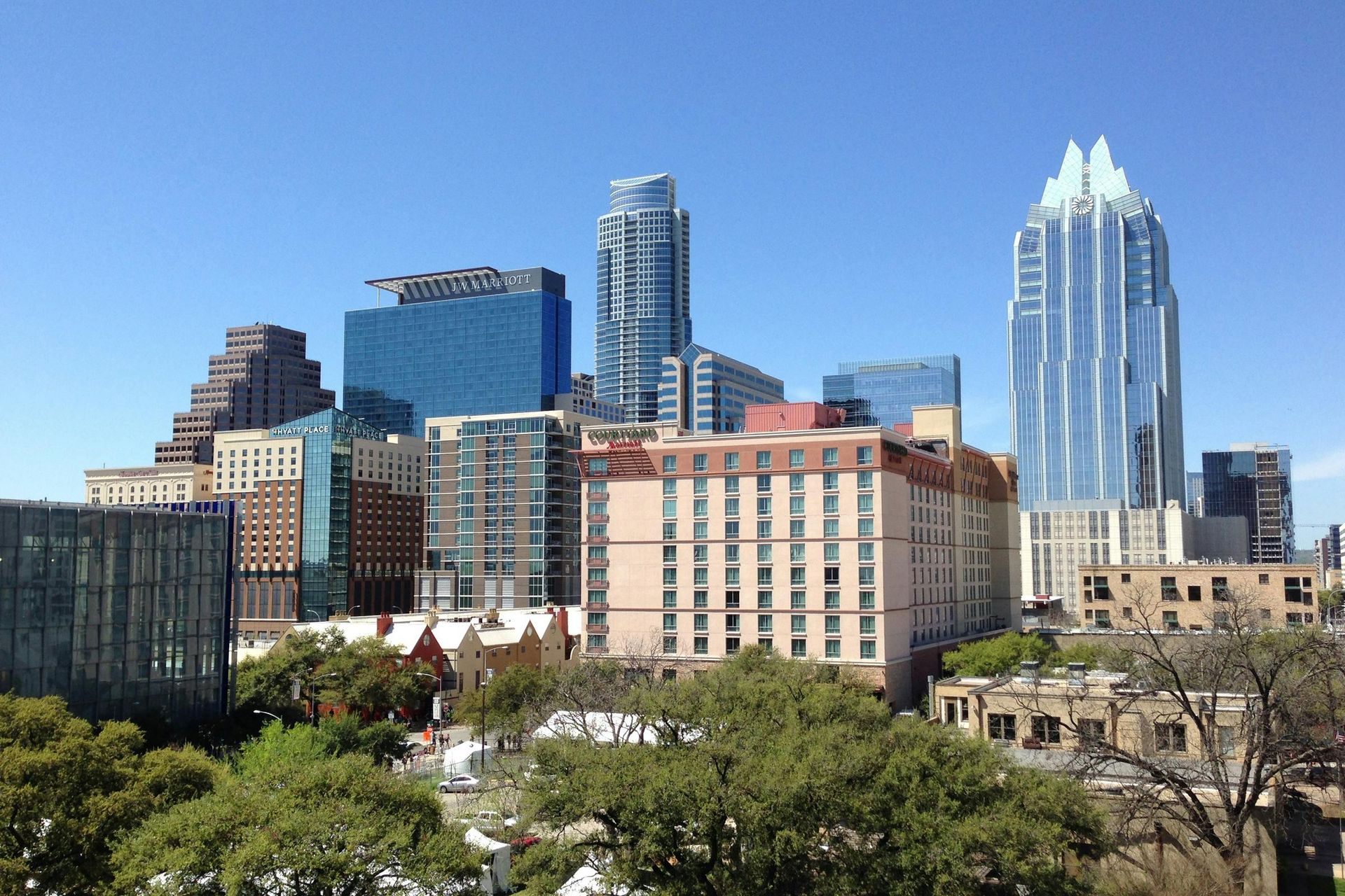 A city skyline with a hotel in the foreground