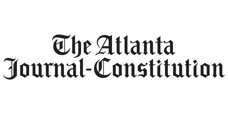 Logo of The Atlanta Journal-Constitution, newspaper title in black gothic font.