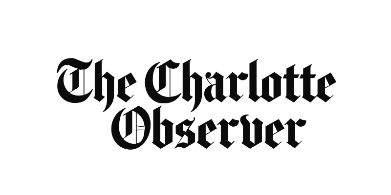 The Charlotte Observer logo in ornate black font.