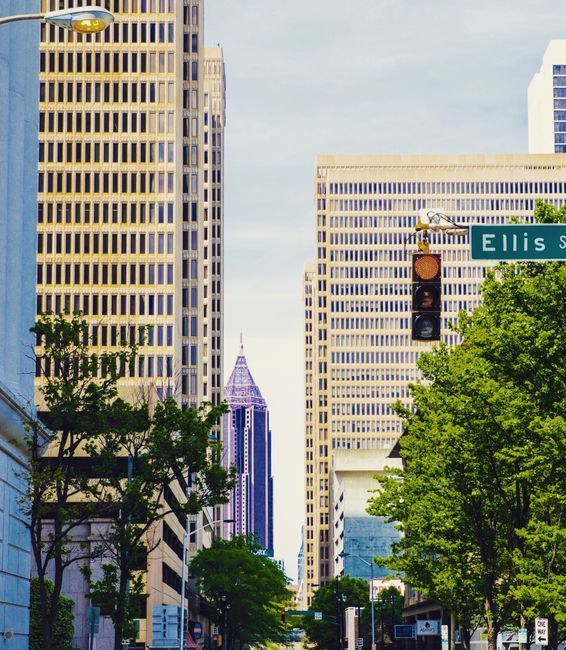 The Atlanta downtown skyline surrounded by green trees