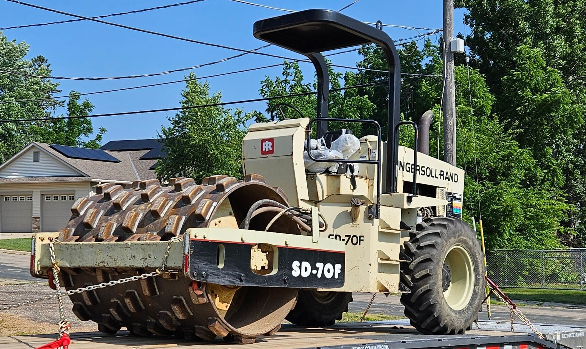 A tractor is parked on the side of the road.