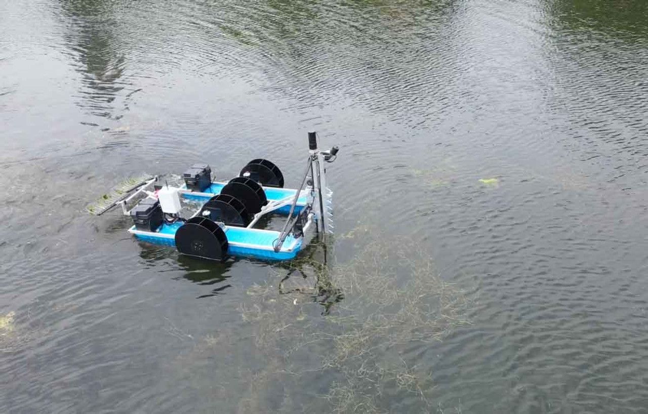 A small boat is floating on top of a body of water.