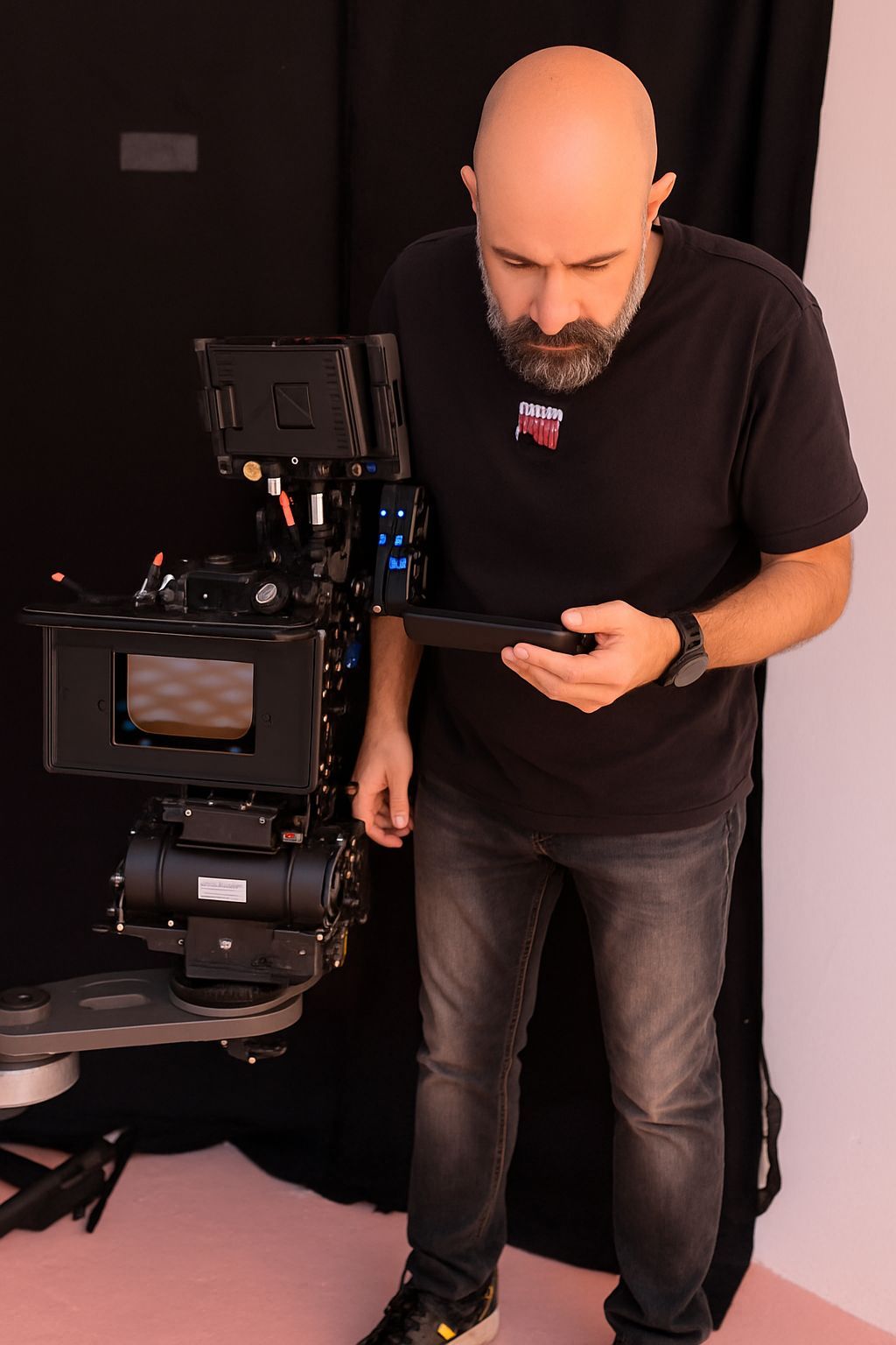 Digital Imaging Technician in Dubai inspecting a cinema camera setup on set with proper lighting and color accuracy.